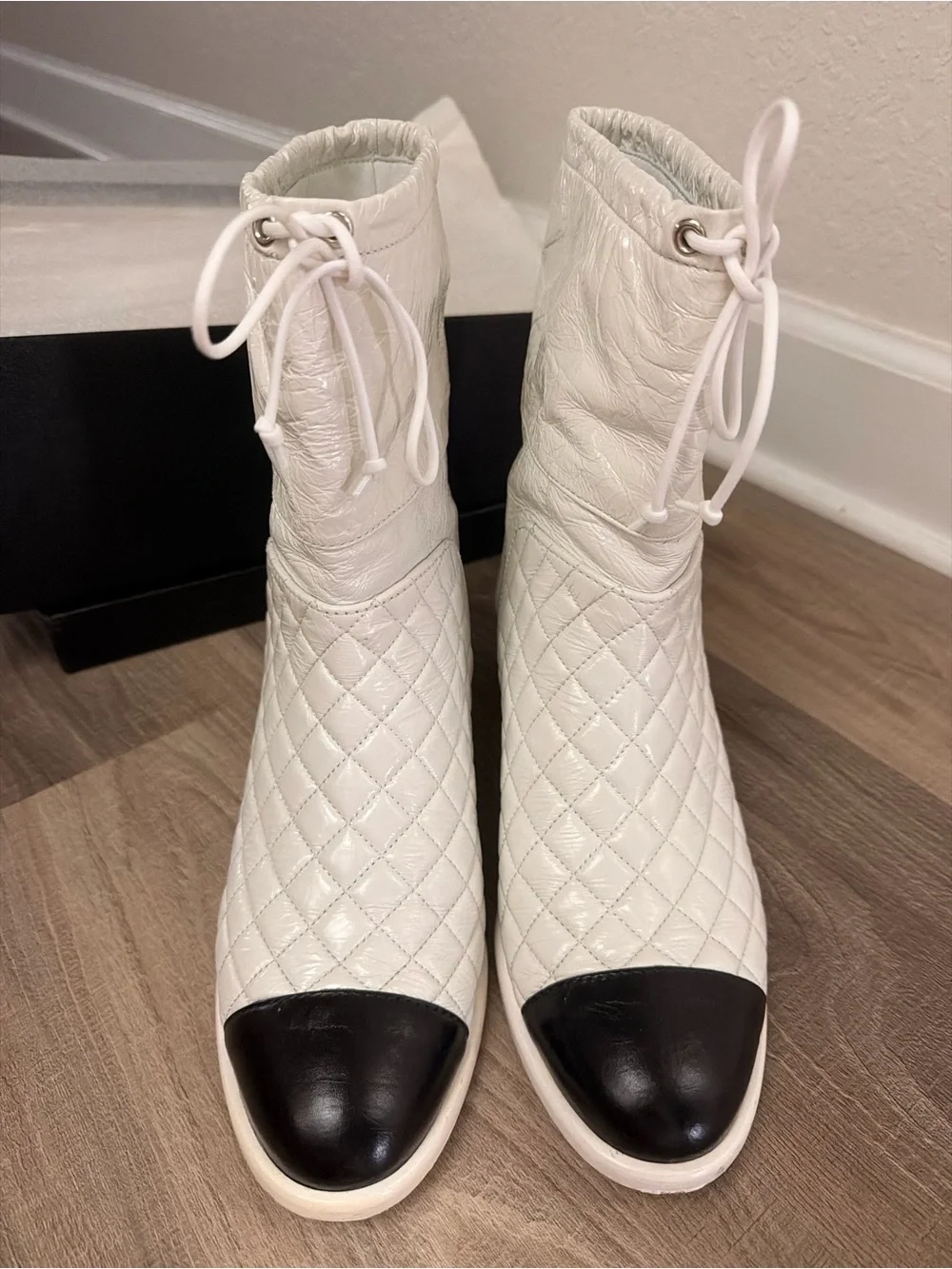 CHANEL White Quilted Leather Ankle Boots with Black Cap Toe and Drawstring